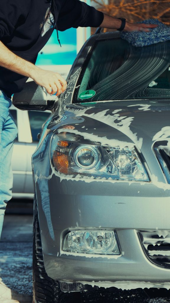 a person washing a car
